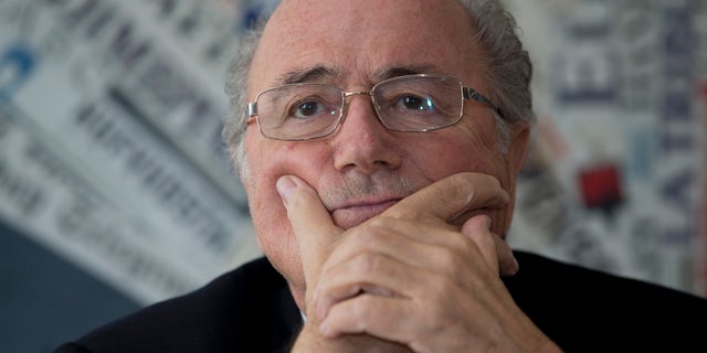 FILE - In this Nov. 22, 2013 file photo, FIFA President Sepp Blatter talks to the media during a meeting with the foreign press, in Rome. Blatter said Friday, Feb. 21, 2014, that video evidence should be used to punish soccer players who dive, fake injuries or waste time. (AP Photo/Andrew Medichini, File)
