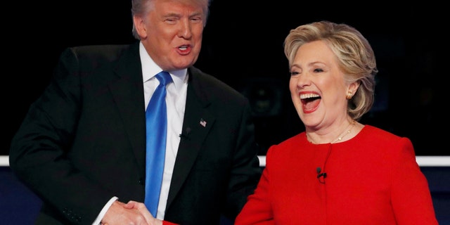 Republican U.S. presidential nominee Donald Trump shakes hands with Democratic U.S. presidential nominee Hillary Clinton at the conclusion of their first presidential debate at Hofstra University in Hempstead, New York, U.S., Sept. 26, 2016. REUTERS/Mike Segar