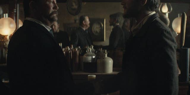 This photo provided by Budweiser shows a scene from the company's spot for Super Bowl 51, between the New England Patriots and Atlanta Falcons, Sunday, Feb. 5, 2017. The scene depicts when Anheuser-Busch co-founder Adolphus Busch, right, after traveling by boat from Germany, met fellow immigrant Eberhard Anheuser. (Budweiser via AP)