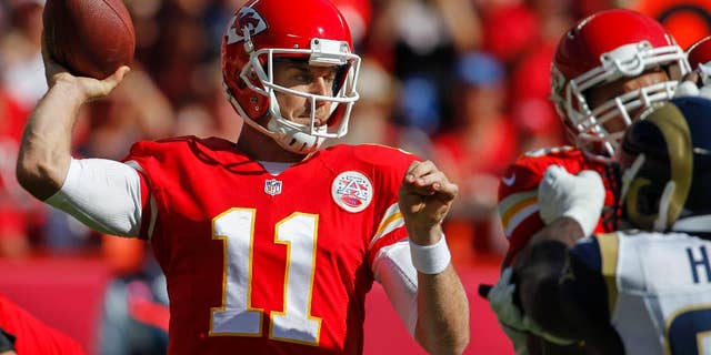 Kansas City Chiefs quarterback Alex Smith (11) throws in the first half of an NFL football game against the St. Louis Rams in Kansas City, Mo., Sunday, Oct. 26, 2014. (AP Photo/Colin E. Braley)