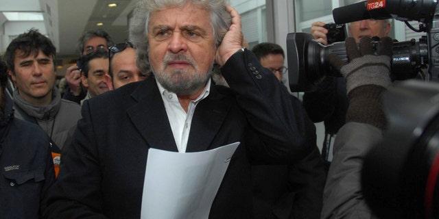 Five Stars movement leader Beppe Grillo arrives in Siena, Italy, Friday, Jan. 25, 2013, to participate in a meeting of shareholders of embattled Italian bank Monte dei Paschi di Siena, who lining up to question managers about a scandal involving potential trading losses that had reportedly been concealed. The world's oldest running bank convened shareholders Friday in Siena to approve capital increases as a condition to receive up to €3.9 billion ($5.22 billion) in state aid. The scandal over the trades caused shares to plunge this week and became a flashpoint in the campaign for national elections. (AP Photo/Riccardo Sanesi, Lapresse) ITALY OUT