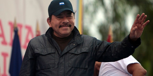 Nicaragua's President Daniel Ortega waves to supporters during an event marking the 32nd anniversary of the Sandinista's withdrawal to Masaya, in Managua, Nicaragua. (AP Photo/Esteban Felix, File)