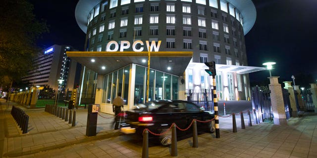 FILE - In this Friday Sept. 27, 2013 file photo a car arrives at the headquarters of the Organization for the Prohibition of Chemical Weapons, OPCW, in The Hague, Netherlands. The OPCW were awarded the Nobel Peace Prize on Friday, Oct. 11, 2013.   (AP Photo/Peter Dejong, File)
