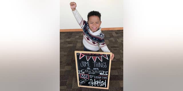This Dec. 20, 2016 photo released by Dezhianna Brown shows her adopted brother Michael Brown in Phoenix. Brown's celebration of his adoption is a hit on social media, with thousands of retweets and likes by Friday, Dec. 23, 2016. (Dezhianna Brown via AP)