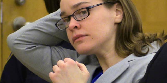 FILE - Defendant Lacey Spears brushes her hair back during the opening statements portion of her murder trial at the Westchester County Courthouse in White Plains, N.Y., in this Feb. 3, 2015 file photo. Summations are scheduled Thursday Feb. 26, 2015 in the case of Lacey Spears, who is charged with murder and manslaughter in the 2014 death of 5-year-old Garnett-Paul Spears. (AP Photo/The Journal-News, Joe Larese, File, Pool)