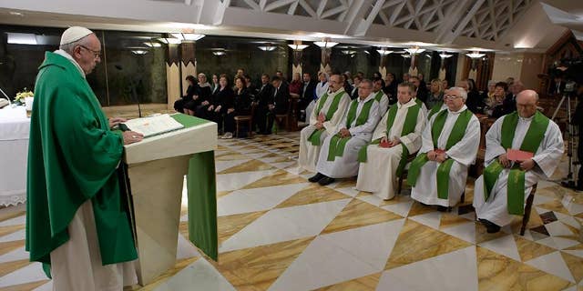 Pope Francis celebrates Mass in the chapel of Santa Marta, at the Vatican, Thursday, Oct. 20, 2016. (L'Osservatore Romano/Pool Photo via AP)