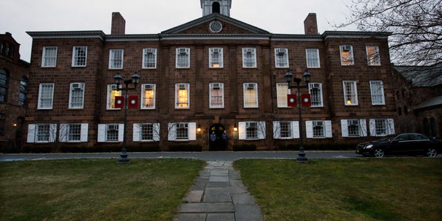 At dusk, lights remain on at Rutgers University's Old Queens building where President Robert Barchi was in a meeting Thursday, April 4, 2013, in New Brunswick, N.J., one day after Rutgers basketball head coach Mike Rice was fired. Rice was fired Wednesday after a videotape aired showing Rice using gay slurs, shoving and grabbing his players and throwing balls at them in practice. Scarlet Knights AD Tim Pernetti was given a copy of the video in late November by a disgruntled former employee, and he suspended Rice for three games, fined him $50,000 and made him undergo anger management classes for inappropriate behavior after investigating it. (AP Photo/Mel Evans)