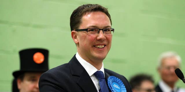 Conservative candidate Robert Courts makes a speech after winning the Witney by-election in Witney, England, Friday, Oct. 21, 2016. Britain's Conservative Party has retained the seat in Parliament vacated by former Prime Minister David Cameron, but with a sharply reduced majority. Conservative candidate Robert Courts won the rural English seat of Witney, taking 45 percent of votes cast _ down from the 60 percent Cameron achieved in the 2015 national election. The centrist Liberal Democrats surged past Labour into second place. Green candidate Larry Sanders _ brother of former Democrat presidential hopeful Bernie Sanders _ came fourth with 3.5 percent of the vote. (Chris Radburn/PA via AP)