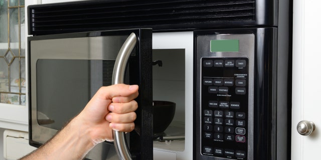 opeing a microwave door