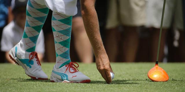 Rickie Fowler tees it up on the eighth hole during the first round of the U.S. Open golf tournament in Pinehurst, N.C., Thursday, June 12, 2014. (AP Photo/Eric Gay)