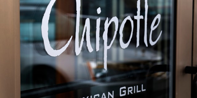 FILE - This Tuesday, Jan. 28, 2014 file photo shows the door of a Chipotle Mexican Grill in Robinson Township, Pa. Chipotle on Monday, April 27, 2015 said it has completed phasing out genetically modified ingredients from its food, making it the first national fast-food chain to do so. (AP Photo/Gene J. Puskar, File)