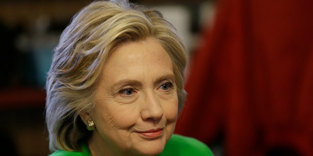 Democratic presidential candidate Hillary Rodham Clinton meets with local residents at the Jones St. Java House, Tuesday, April 14, 2015, in LeClaire, Iowa. (AP Photo/Charlie Neibergall)