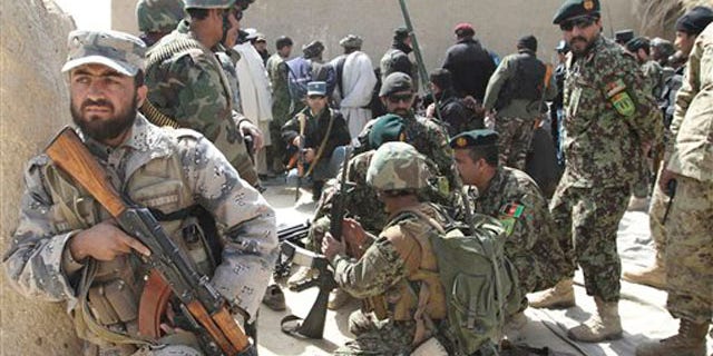 March 13, 2012: Afghan security forces are seen after Taliban militants opened fire on a delegation of senior Afghan officials in Panjwai, Kandahar province south of Kabul, Afghanistan.