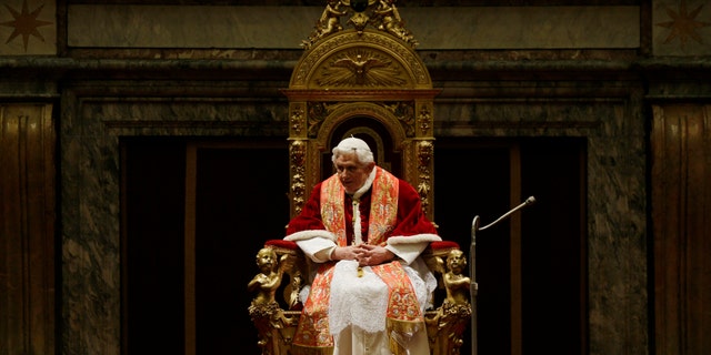 Pope Benedict XVI delivers his message on the occasion of the exchange of Christmas greetings with the Roman curia, in the Clementine hall at Vatican, Friday, Dec. 21, 2012. (AP Photo/Alessandra Tarantino, pool)