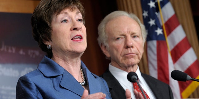 Senate Homeland Security Committee Chairman Sen. Joseph Lieberman, I-Conn. listens at right, as the committee's ranking Republican, Sen. Susan Collins, R-Maine speaks during a news conference on Capitol Hill in Washington, Monday, Dec. 31, 2012, to discuss the committee's report on the security deficiencies at the temporary U.S. Mission in Benghazi, Libya. (AP Photo/Susan Walsh)