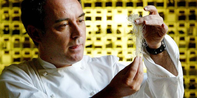 Dec. 5, 2003: Spanish chef Ferran Adria examines ingredients in his kitchen workshop in Barcelona, Spain.