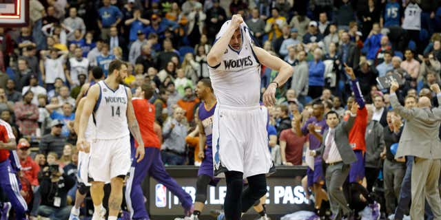 Minnesota Timberwolves' Kevin Love pulls his jersey over his head as he leaves the court after the Phoenix Suns came from behind to beat the Timberwolves 104-103 in an NBA basketball game Wednesday, Jan. 8, 2014, in Minneapolis. (AP Photo/Jim Mone)