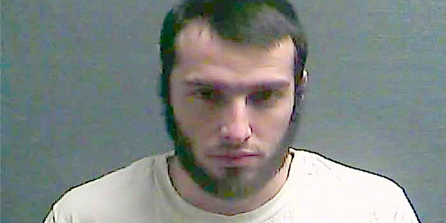 FILE – This July 29, 2016, file booking photo made available by the Boone County Jail in Burlington, Ky., shows Christopher Lee Cornell of Green Township in suburban Cincinnati. Federal authorities say Cornell, who plotted to attack the U.S. Capitol during President Barack Obama's 2015 State of the Union address, kept trying from behind bars to incite others to violence in support of the Islamic State. Prosecutors describe Cornell’s “post-arrest conduct and misconduct” as unusual in a sentencing memorandum filed ahead of a Dec. 5, 2016, sentencing hearing. They want a judge to sentence him to 30 years in prison after he pleaded guilty earlier in 2016 to three charges. (Boone County Jail via AP, File)