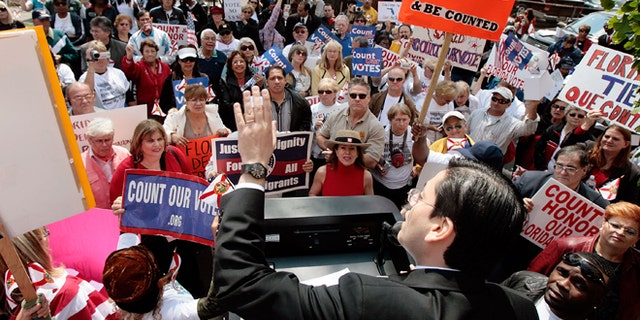 WASHINGTON - APRIL 30: Luis Miranda, deputy communications director for the Democratic National Committee, addresses a group of people rallying for Florida's Democratic primary to be counted during a demonstration at DNC headquarters April 30, 2008 in Washington, DC. Miranda said Florida would recieve representation at the Democratic National convention in Denver later this year but would not make any formal announcement regarding the primary. Organized by The League of United Latin American Citizens, about 200 people shouted "Count our vote!" and "Where is Howard," referring to DNC Chairman Howard Dean. (Photo by Chip Somodevilla/Getty Images)