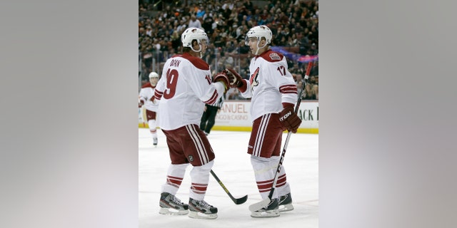Phoenix Coyotes right wing Radim Vrbata, right, celebrates his goal with teammate Shane Doan during the first period of an NHL hockey game against the Anaheim Ducks in Anaheim, Calif., Saturday, April 27, 2013. (AP Photo/Chris Carlson)