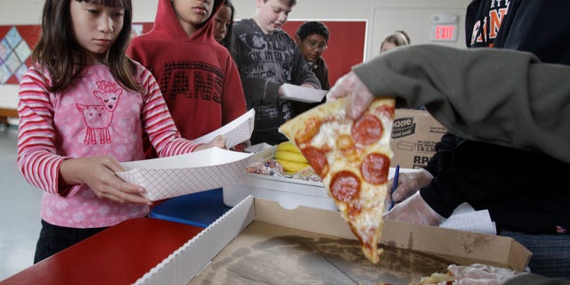 Dec. 2, 2012: A Fairmeadow Elementary School student orders pepperoni pizza during a school lunch program in Palo Alto, Calif.