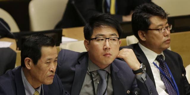 Kim Ju Song, a member of the North Korea delegation, attends a panel discussion on human rights abuses in North Korea at United Nations headquarters, Wednesday, Oct. 22, 2014. (AP Photo/Seth Wenig)