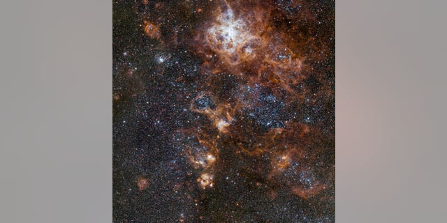 This image from VLT Survey Telescope at ESO'S Paranal Observatory in Chile showcases the brilliant Tarantula Nebula in the Large Magellanic Cloud.
