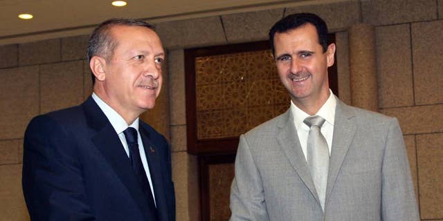 Syrian President Bashar al-Assad, right, shakes hands with Turkey's then-Prime Minister Recep Tayyip Erdogan in 2010.