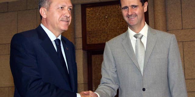 Syrian President Bashar al-Assad, right, shakes hands with Turkey's then-Prime Minister Recep Tayyip Erdogan in 2010.