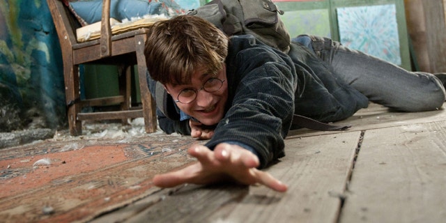In this film publicity image released by Warner Bros. Pictures, Daniel Radcliffe is shown in a scene from "Harry Porter The Deathly Hallows: Part 1."