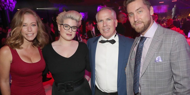 (From left) Kendra Wilkinson, Kelly Osbourne, Thomas J. Henry and Lance Bass pose for a group photo during the Thomas J. Henry Law Firm’s Celebration of 25 Years Of Excellence event in San Antonio, Texas in 2018.