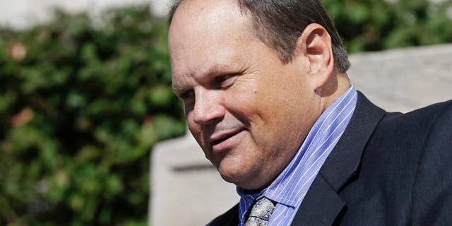 FILE - In this Sept. 9, 2015, file photo, former Multi-State Lottery Association security director Eddie Tipton leaves the Polk County Courthouse in Des Moines, Iowa, after his sentencing in a jackpot-fixing scandal. A judge says the winner of a Hot Lotto jackpot can continue a lawsuit that contends he would have won millions more if the prior drawing had not been rigged by a lottery vendor. Judge Karen Romano has rejected requests to dismiss the case, which is the first filed against the Multi-State Lottery Association over a jackpot-rigging scandal inside the organization. (AP Photo/Charlie Neibergall, File)