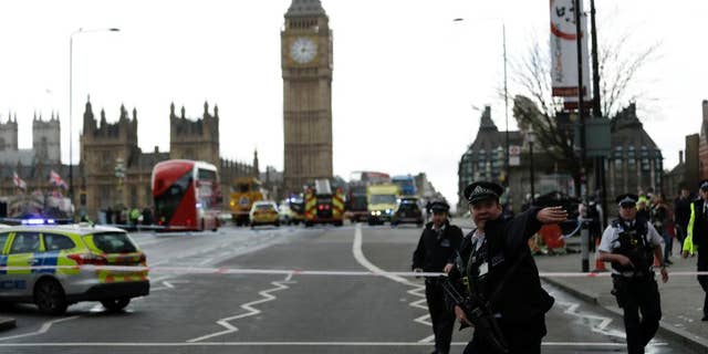 Police direct traffic approaching Westminster Bridge after the March 22, 2017 attack.