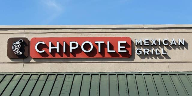 This Monday, Feb. 8, 2016, photo shows the sign over a Chipotle Mexican Grill in Brandon, Fla. The Chipotle marketing executive leading the chain's efforts to rebound after an E. coli outbreak was arrested Tuesday, July 5, 2016, on multiple counts of cocaine possession. (AP Photo/Chris O'Meara)