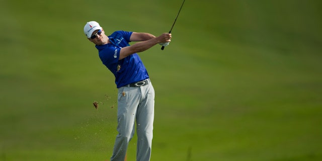 Zach Johnson hits off the 18th fairway during the final round of the Tournament of Champions golf tournament, Monday, Jan. 6, 2014, in Kapalua, Hawaii. (AP Photo/Marco Garcia)