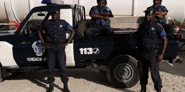 Angolan police officers stand guard in Luanda on January 16, 2010
