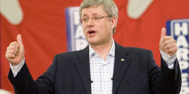 May 1: Prime Minister Stephen Harper gives a thumbs up after speaking in a campaign rally in Stratford, Prince Edward Island, Canada near Charlottetown on Sunday. Unexpected gains for the New Democratic Party have upended previous soundings that predicted the Conservatives would get enough votes to form a minority government, perhaps even a majority one. Now a new scenario has emerged in which the New Democrats and the Liberals together win enough seats to eventually form a coalition. (AP Photo/The Canadian Press