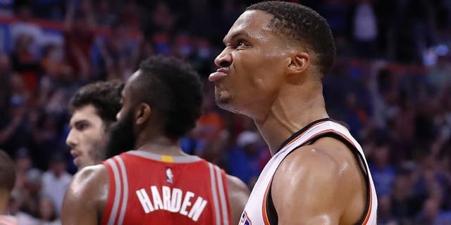 Oklahoma City Thunder guard Russell Westbrook (0) reacts after dunking against the Houston Rockets during the second half of an NBA basketball game in Oklahoma City, Wednesday, Nov. 16, 2016. Oklahoma City won 105-103. (AP Photo/Alonzo Adams)