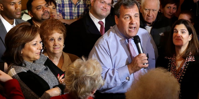 New Mexico Governor Susana Martinez, left, listens along with New Jersey first lady Mary Pat Christie, right, as New Jersey Gov. Chris Christie greets supporters during a campaign stop in Hillside, N.J., Monday, Nov. 4, 2013. Christie will face Democratic candidate, Barbara Buono in an election Tuesday, Nov. 5, 2013. (AP Photo/Mel Evans)