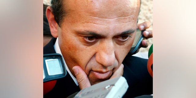 FILE - In this Aug. 28, 2007 file photo, Sevilla soccer club President, Jose Maria del Nido, speaks to the press in Athens. A Spanish court on Thursday Dec. 5, 2013 has sentenced the president of Sevilla's football club to seven years in prison for embezzlement and corruption. Madrid's Supreme Court upheld most of a 2011 ruling by a lesser court that found Jose Maria del Nido guilty of involvement in the embezzlement of public funds in the southern resort town of Marbella. The Supreme Court reduced the original sentence of 7-1/2 years by six months. (AP Photo/Miguel Angel Morenatti, File)