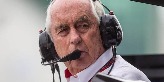 Roger Penske, owner of Team Penske, stands in the pits during a qualifying session for the IndyCar auto race in Toronto on Saturday, July 19, 2014. (AP Photo/The Canadian Press, Chris Young)