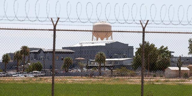 FILE - In this July 23, 2014, file photo, a fence surrounds the state prison in Florence, Ariz., where the execution of Joseph Rudolph Wood took place. (AP Photo/File)