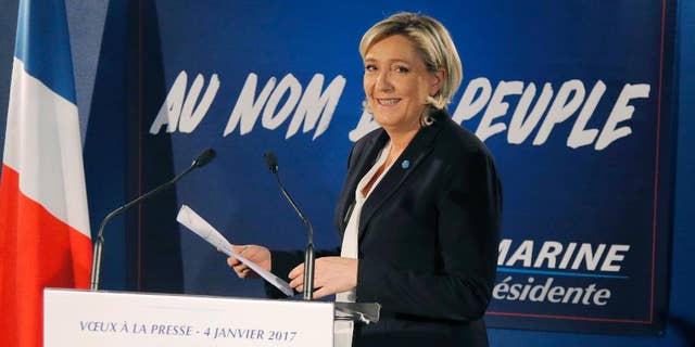 Far-right leader and candidate for next spring presidential elections Marine le Pen, arrives for her New Year's address to the media in Paris, Wednesday, Jan. 4, 2017. French far right presidential candidate Marine Le Pen is cheering Ford Motor Co.'s decision to shift investment from Mexico to the U.S., calling it a victory for the protectionist policies she champions. (AP Photo/Michel Euler)
