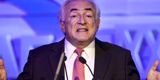 Dec. 19, 2011: Former IMF head Dominique Strauss-Kahn gestures as he speaks at an economy conference organized by Chinese Internet company Netease in Beijing, China.
