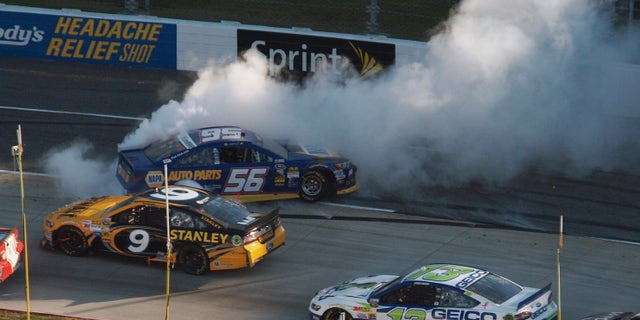 Sprint Cup Series driver Martin Truex Jr. (56) spins out as Marcos Ambrose (9) and Casey Mears (13) pass by during the NASCAR Sprint Cup auto race at Martinsville Speedway in Martinsville, Va., Sunday, Oct. 27, 2013. (AP Photo/Steve Sheppard)
