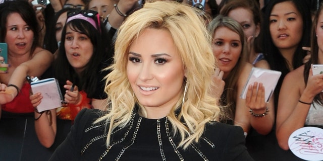 TORONTO, ON - JUNE 16: Demi Lovato arrives on the red carpet at the 2013 MuchMusic Video Awards at Bell Media Headquarters on June 16, 2013 in Toronto, Canada. (Photo by Jag Gundu/Getty Images)