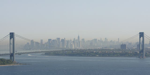 A layer of smog can be seen above Manhattan through the Verrazano-Narrows Bridge in New York.
