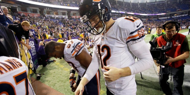 Chicago Bears quarterback Josh McCown (12) walks off the field after an NFL football game against the Minnesota Vikings, Sunday, Dec. 1, 2013, in Minneapolis. The Vikings won 23-20 in overtime. (AP Photo/Jim Mone)