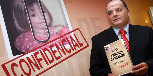 FILE - In this July 24, 2008 file photo, former detective Goncalo Amaral poses with his book whose title translates as "The Truth in the Lies", during its launch in Lisbon. Portugal's Supreme Court has ruled that missing British girl Madeleine McCann's parents can't sue for libel a former Portuguese detective who published a book alleging they were involved in their daughter's disappearance. A court official told The Associated Press on Tuesday, Jan. 31, 2017 that Portugal's highest court ruled the allegations are protected by freedom of expression laws and weren't abusive. (AP Photo/Joao Henriques, file)