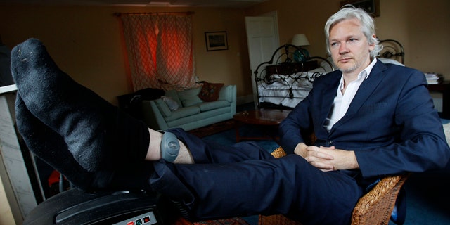 June 15, 2011: WikiLeaks founder Julian Assange is seen with his ankle security tag at the house where he is required to stay in, near Bungay, England.